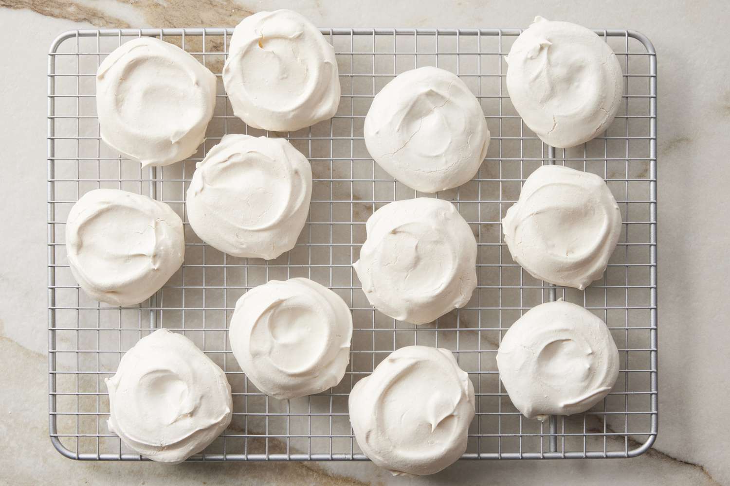 Mini pavlovas cooling on wire rack