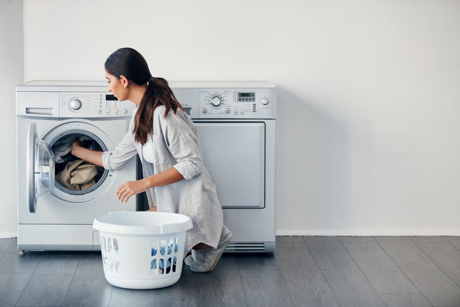 Woman emptying laundry room