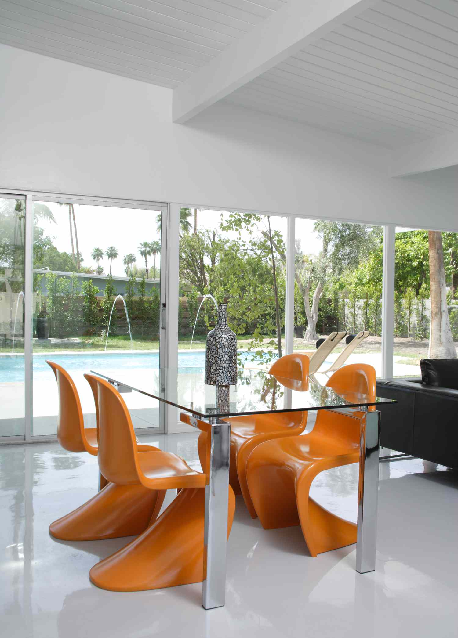 room with orange panton chairs