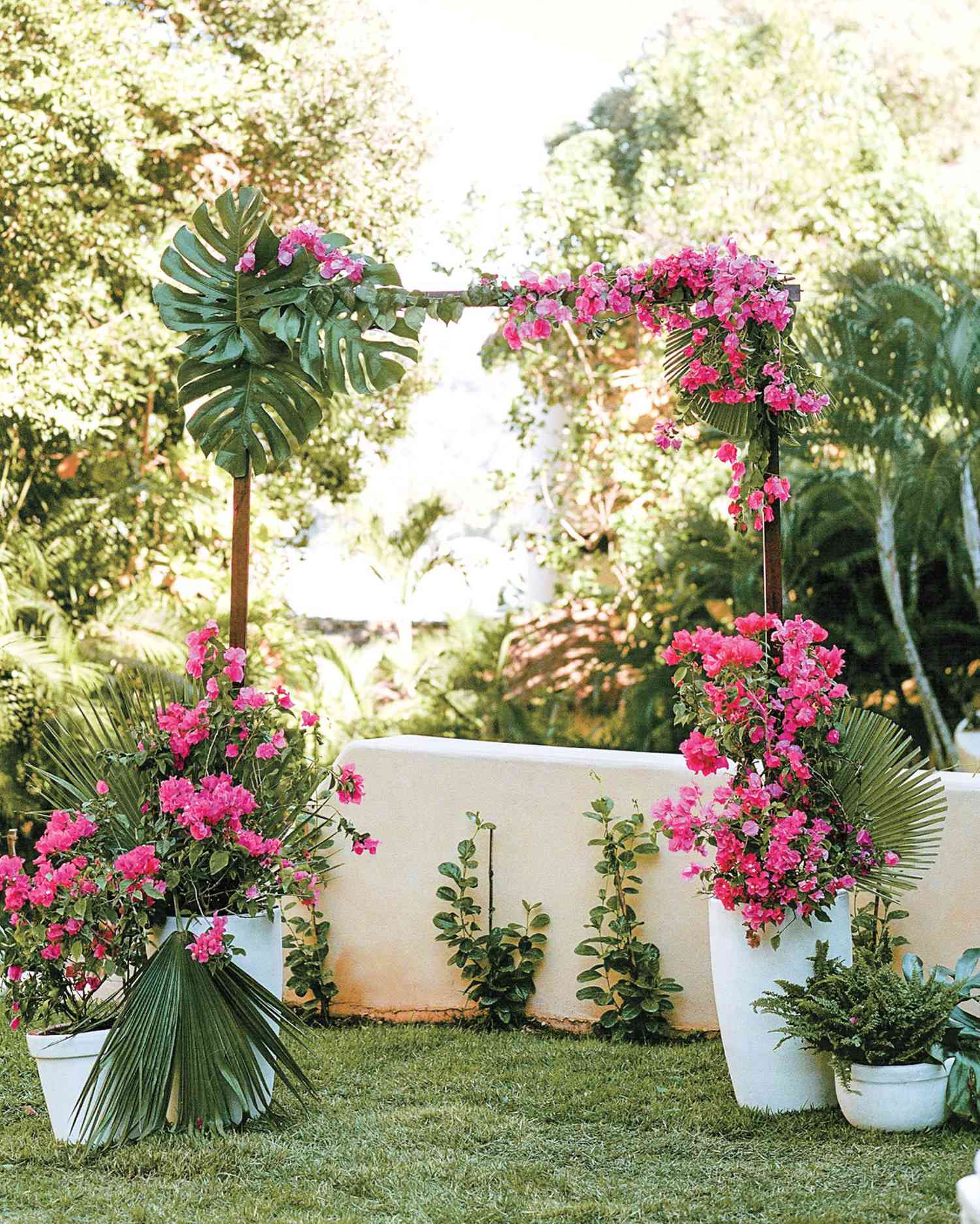 Unkempt Willow Branch Wedding Arch with Pink and Orange Flowers