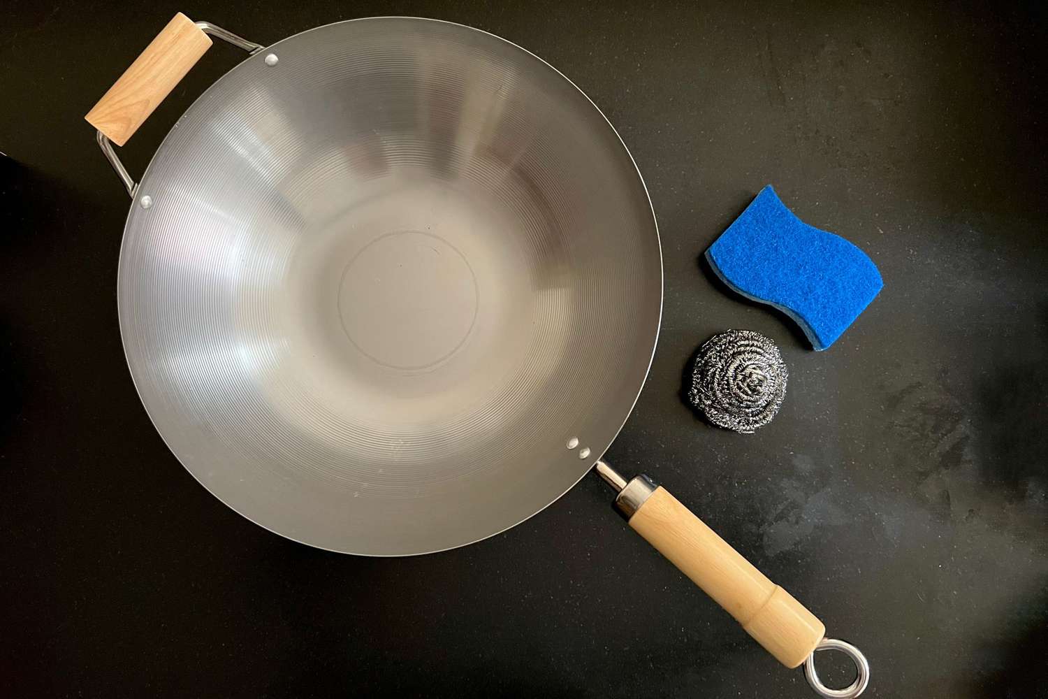 wok and cleaning sponge