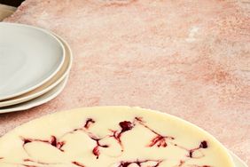 round cranberry cheesecake with slice cut