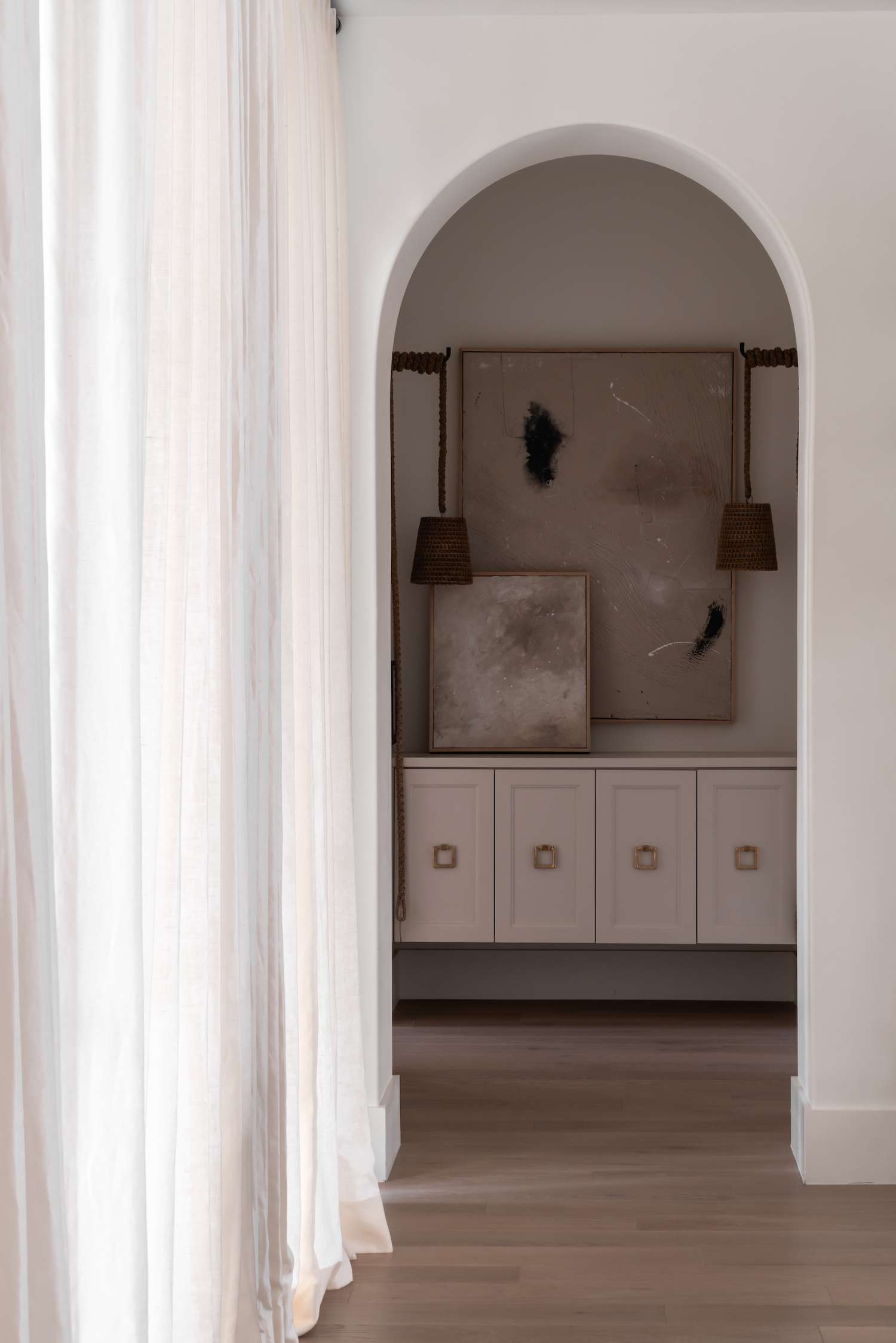 muted hallway with matching lamp sconces