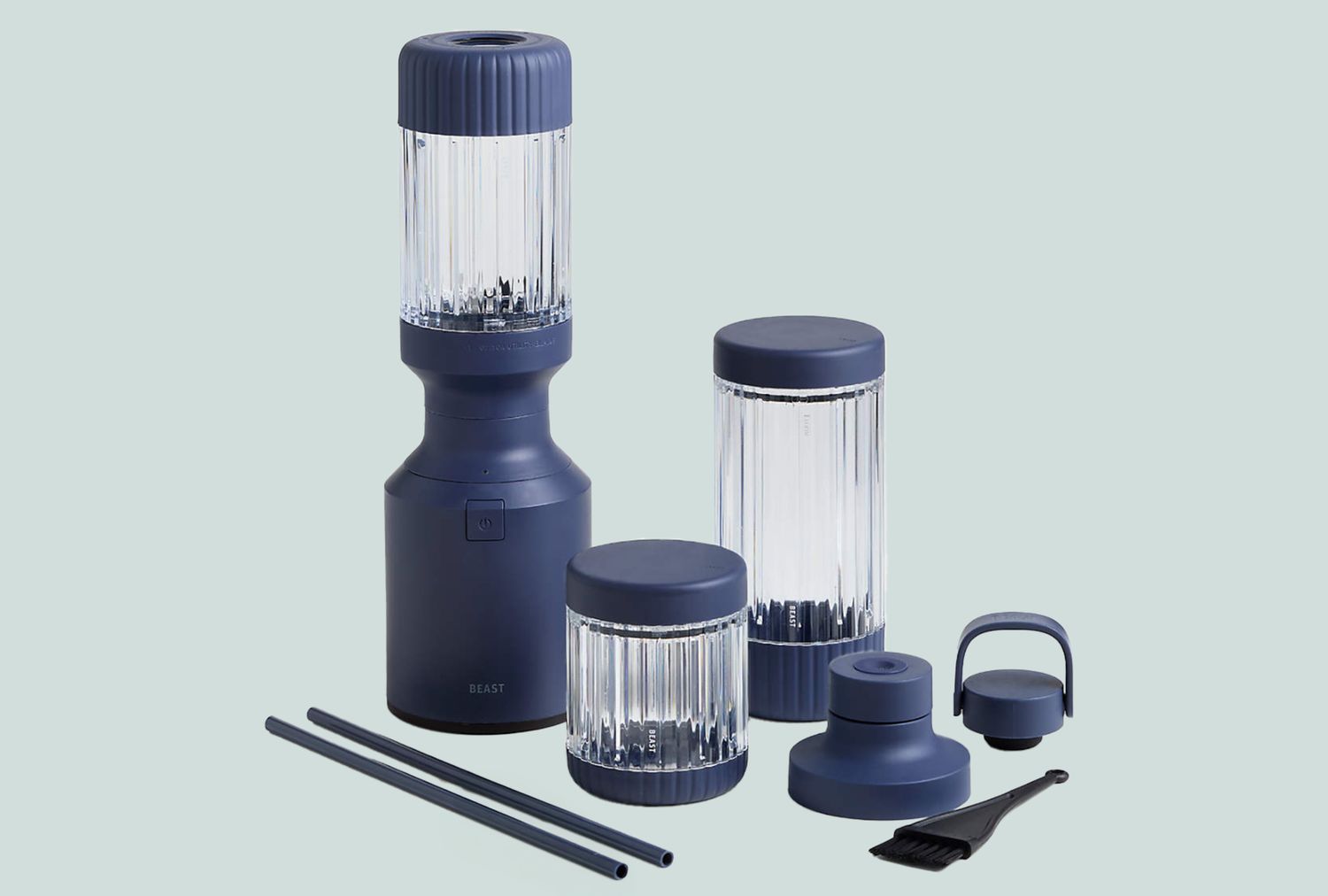 Set of a portable blender with its detachable components and accessories on display