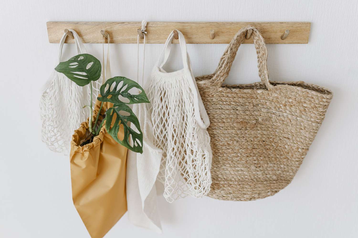 Eco friendly bags hanging on coat hook