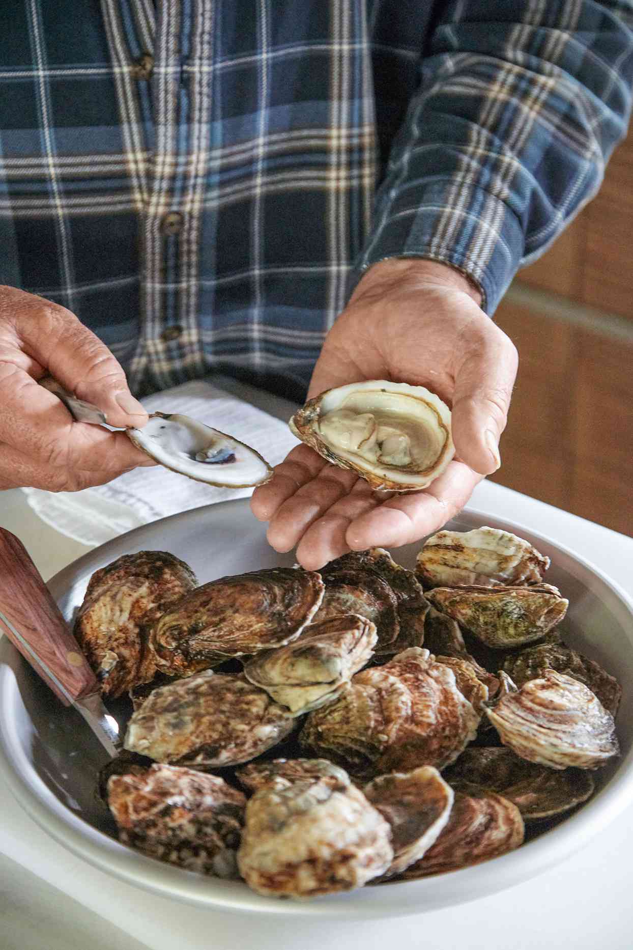second step of shucking an oyster