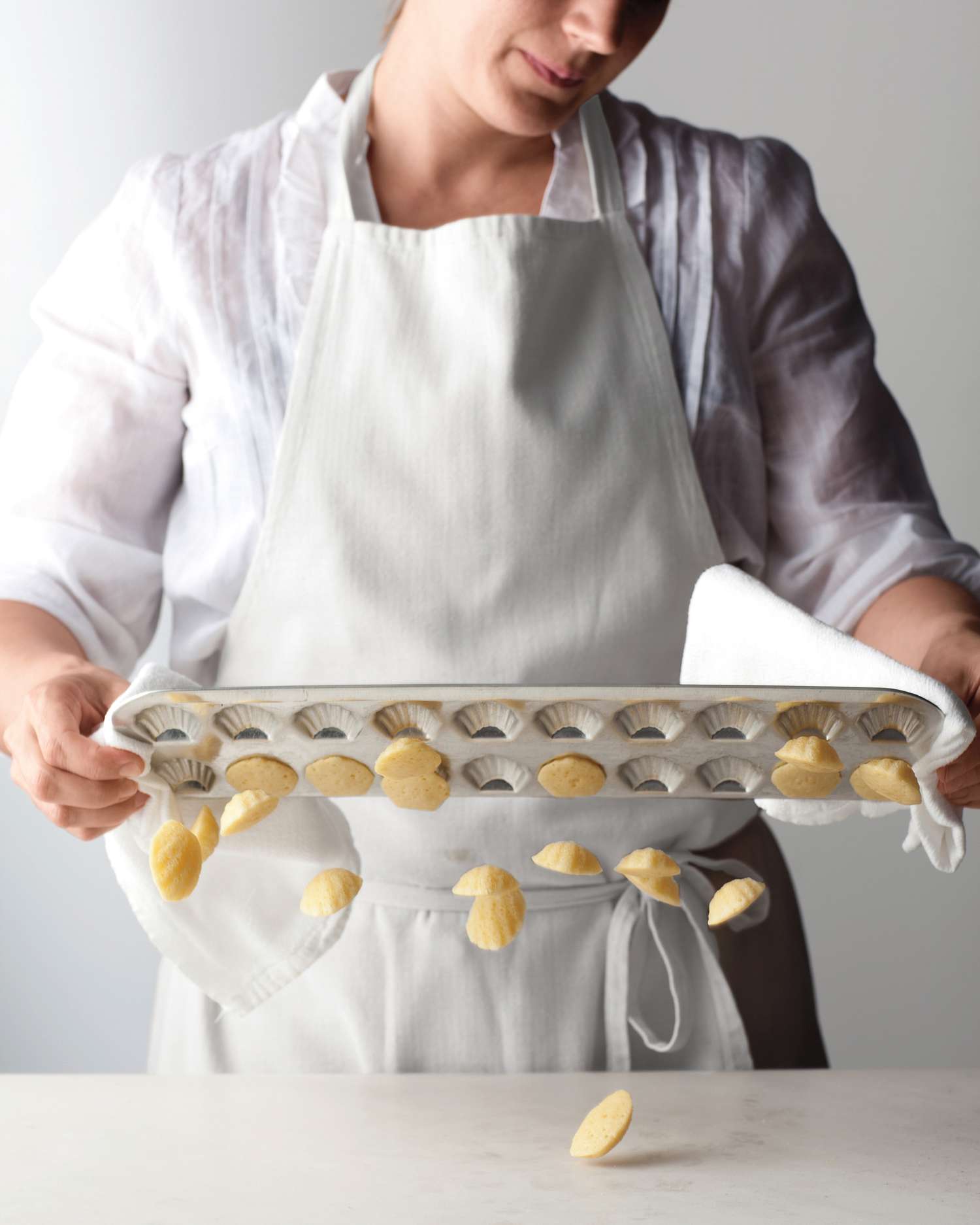 Madeleines being taken out of mold