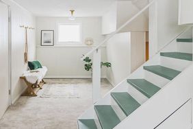 white basement with turquoise stairs