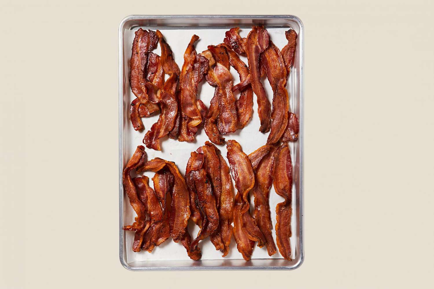 cooked bacon on sheet pan