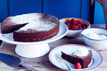 flourless chocolate-almond cake against blue wall
