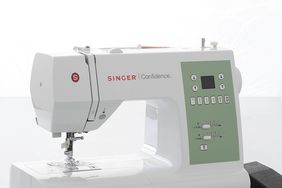 singer sewing machine on table