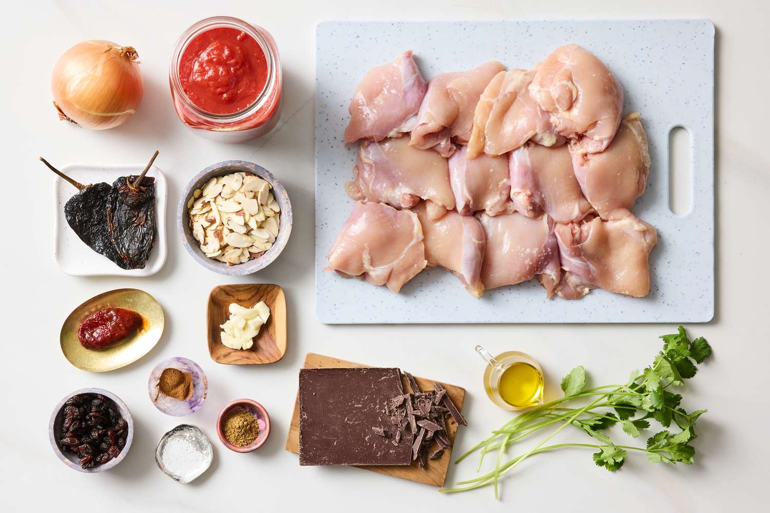 Ingredients for making slow cooker chicken mole arranged on a surface
