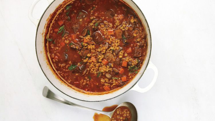 fit to eat beef soup in a white pot with silver ladle
