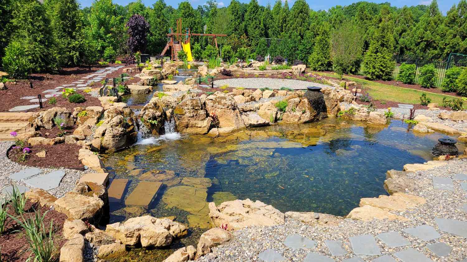 natural swimming pool pond with rocks
