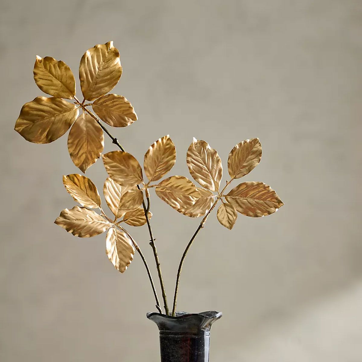 Ornamental gold foliage in a vase