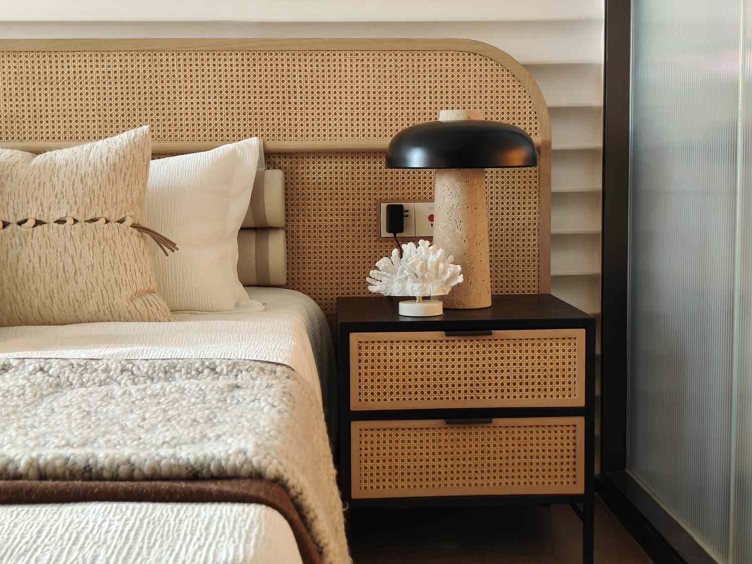 Bedroom with rattan bed and nightstand