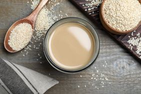 Jar of tahini with sesame seeds