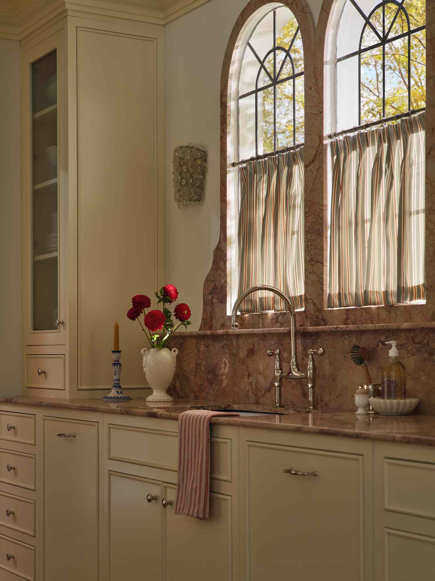 a kitchen with white metal hardware