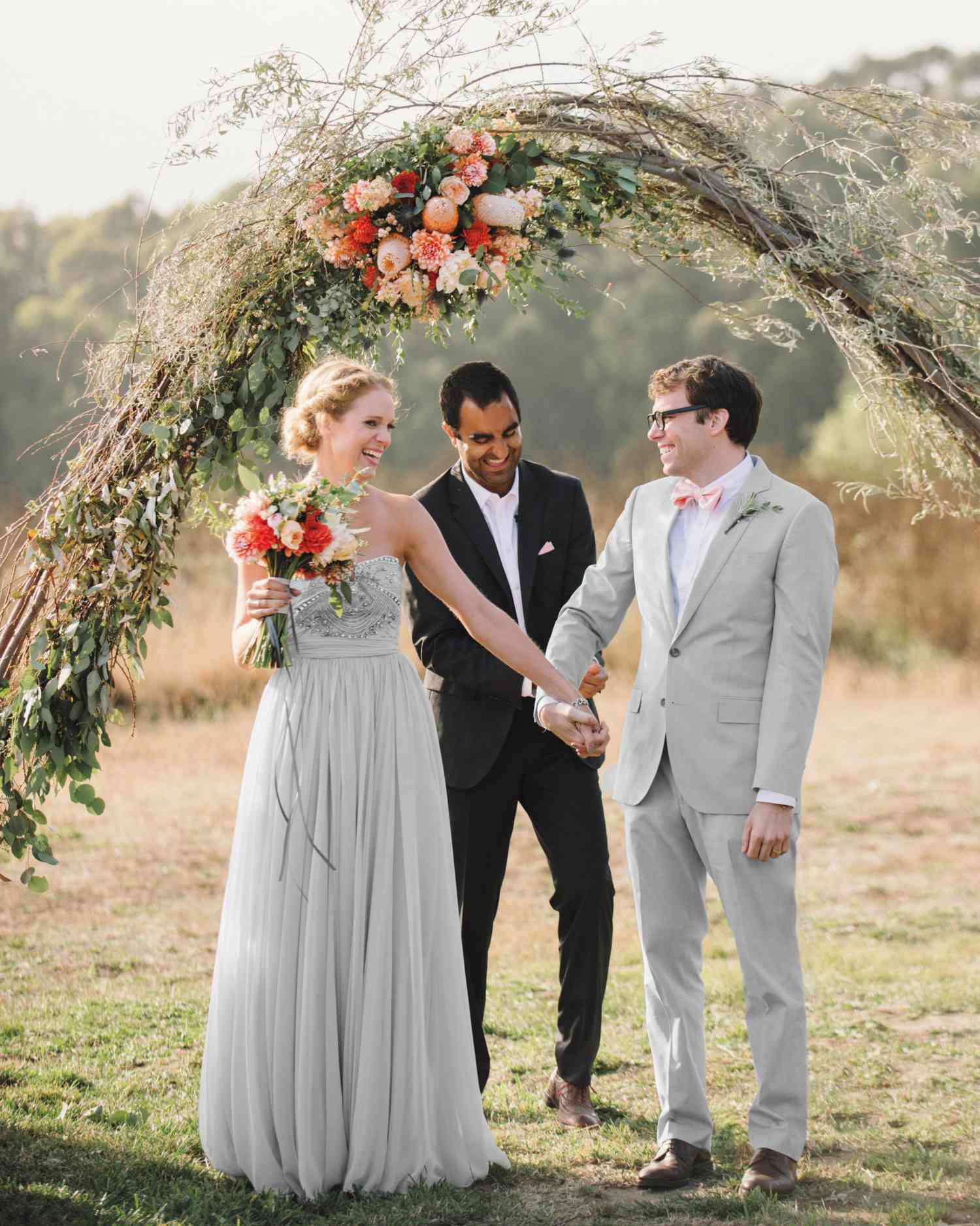 Unkempt Willow Branch Wedding Arch with Pink and Orange Flowers