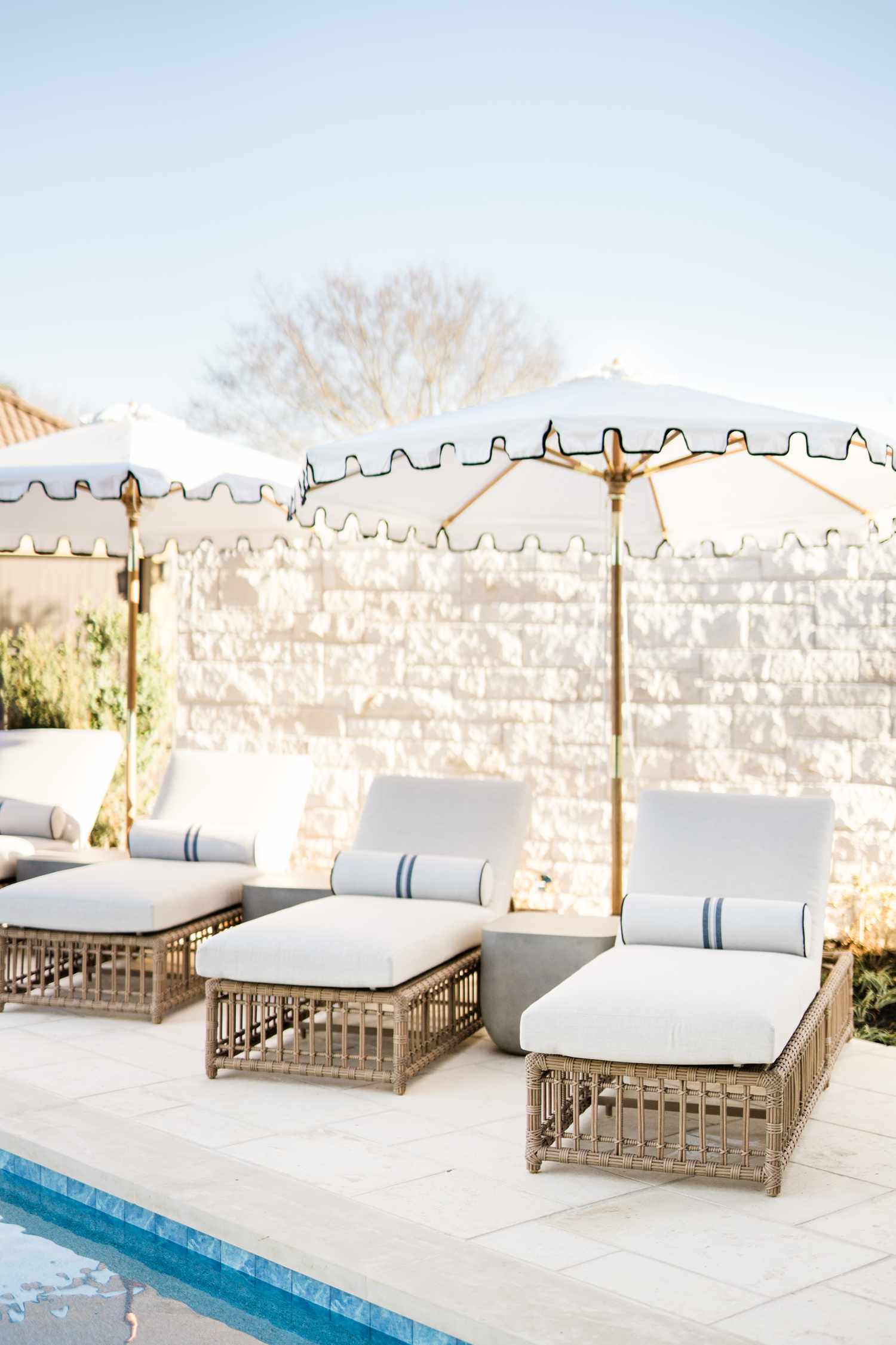 Multiple Matching Umbrellas with Chaise Lounges