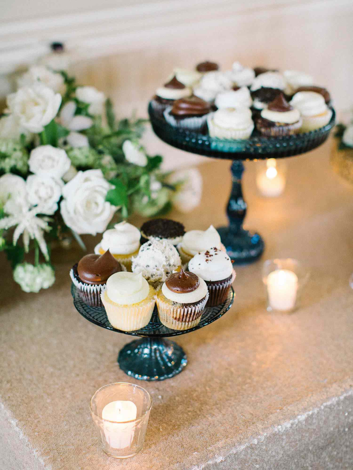chocolate and vanilla frosted cupcakes on a stand