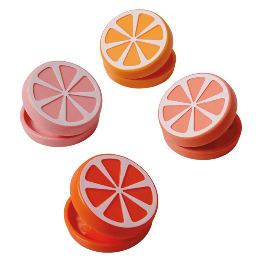 Four citrusshaped bag closure clips shown