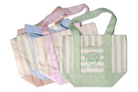 Reusable tote bags with Trader Joes logo arranged in multiple colors