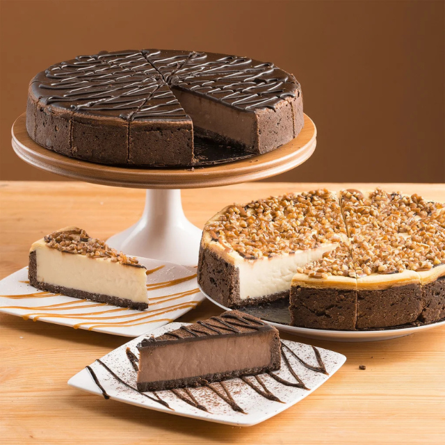 Assorted cheesecakes with slices on display