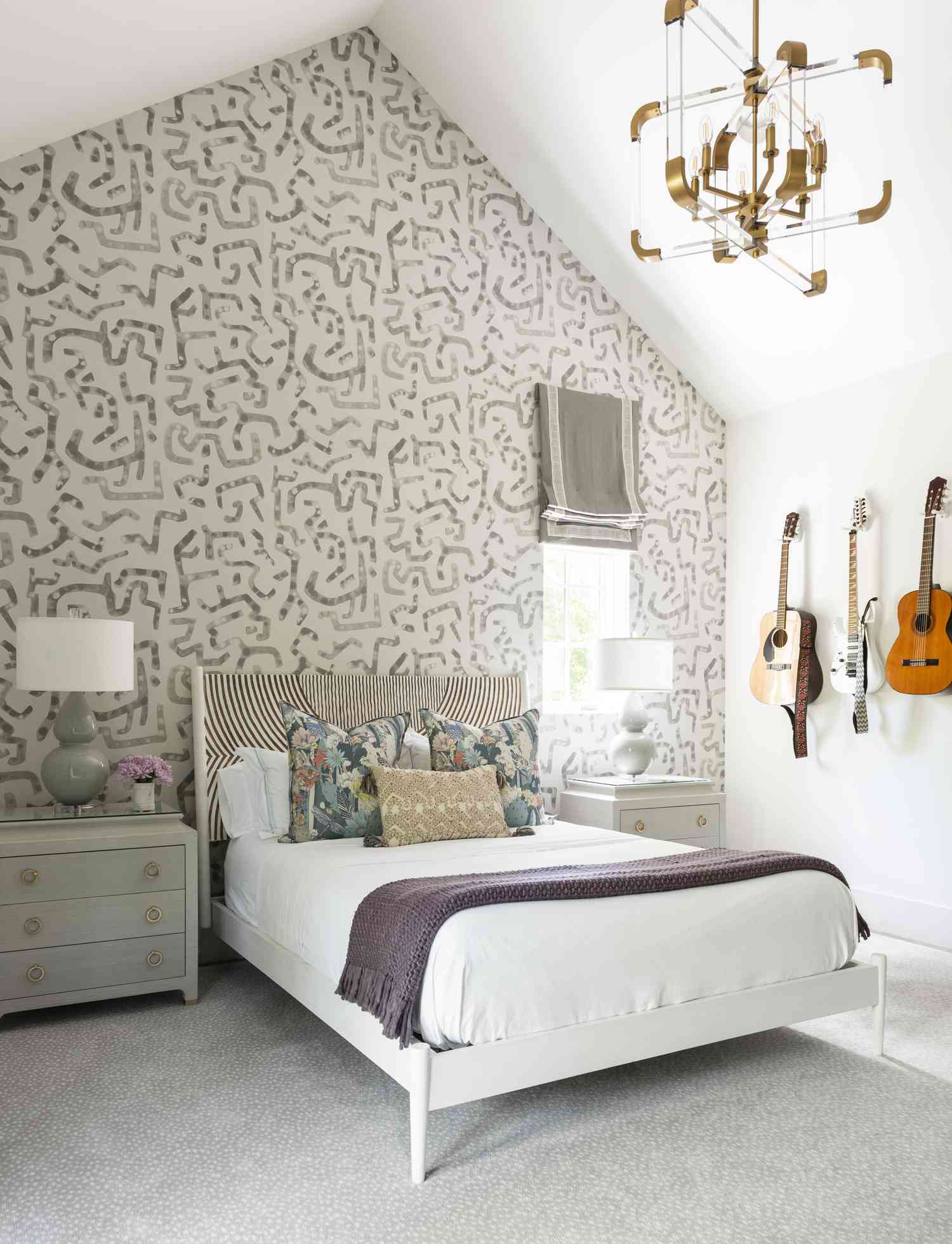 teen girl's bedroom with guitars and neutral decor