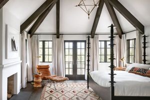 white master bedroom with mahogany four poster bed