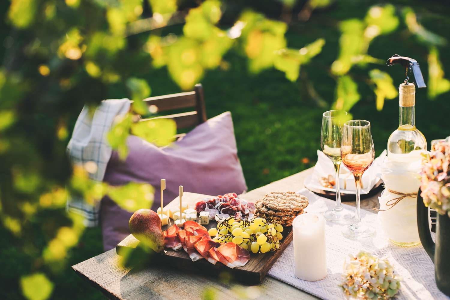 summer party table with quick bites and wine