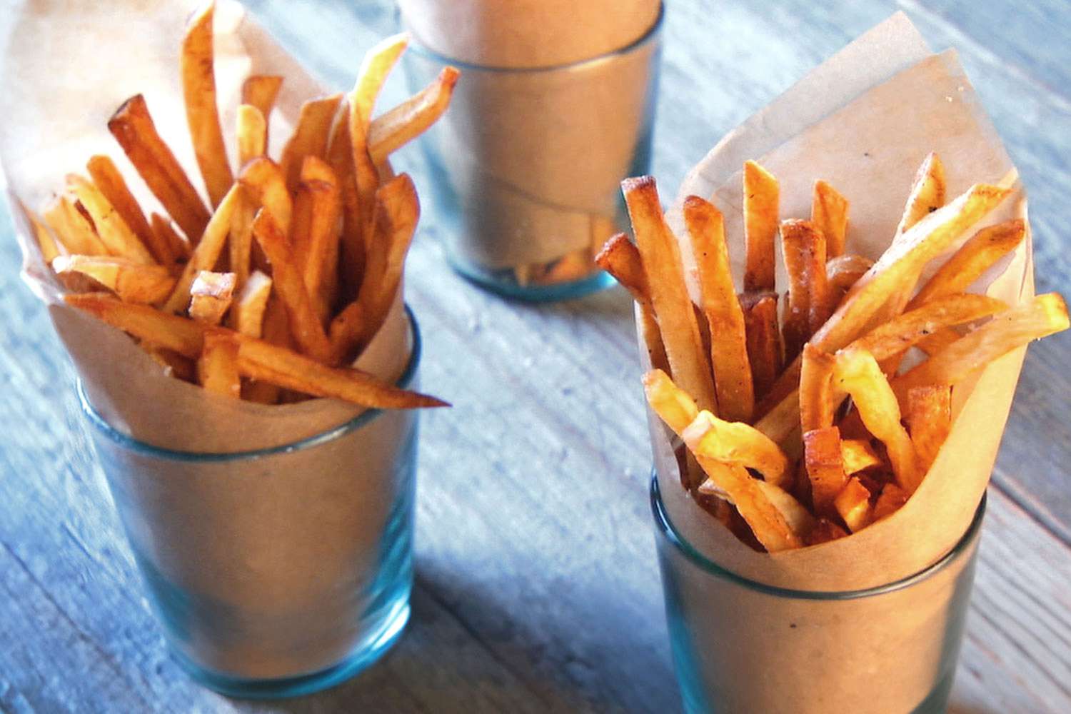 Two cups of crispy french fries