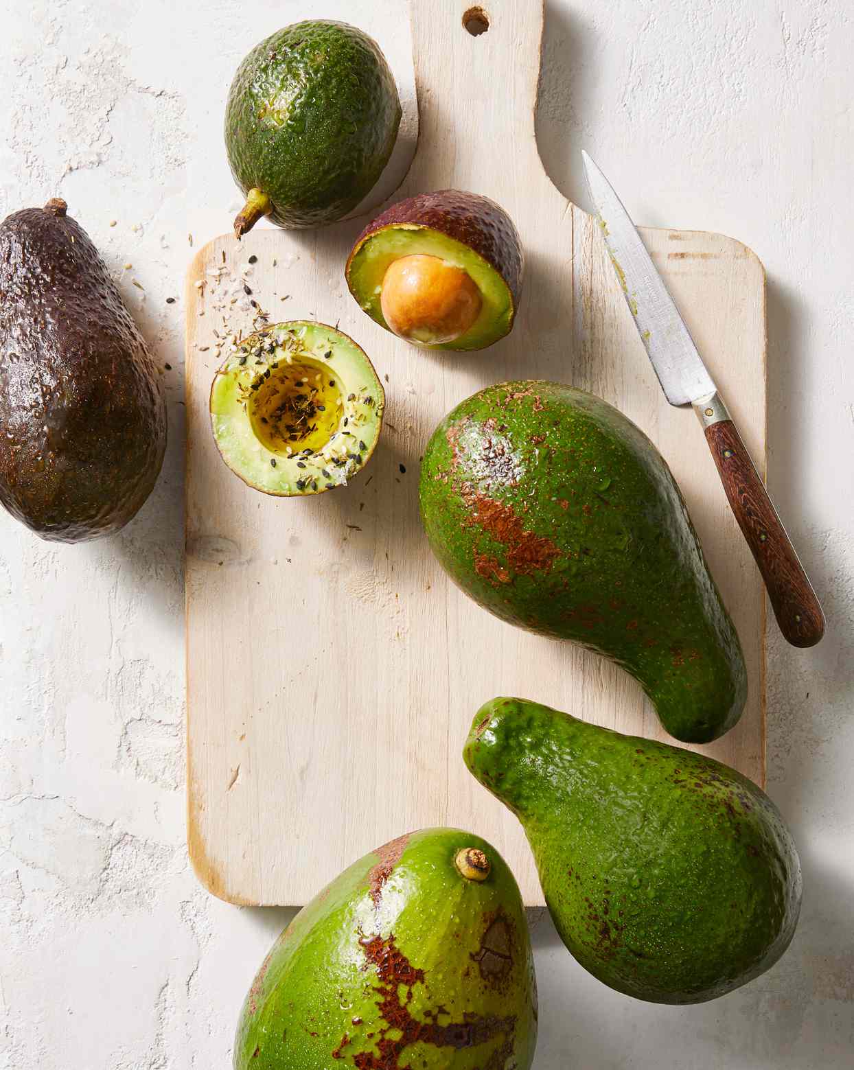 sliced avocados on cutting board