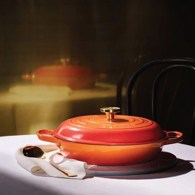 Signature Round Braiser with Crucible Knob in Flamme Dorée from Le Creuset. 