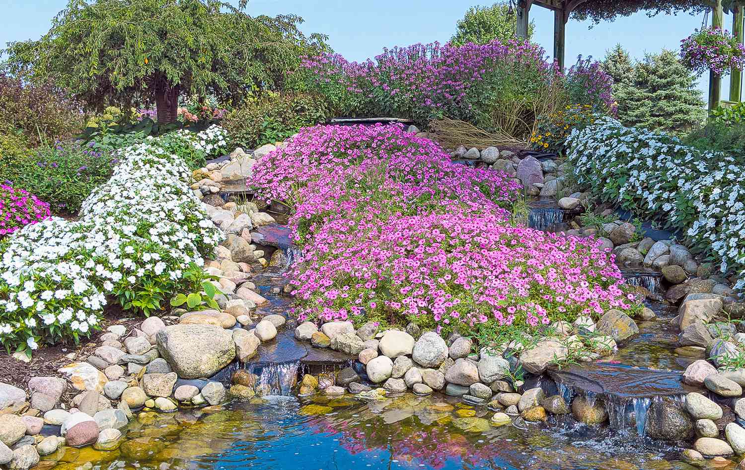 Rock garden with water feature and flowers