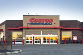 A Costco Wholesale storefront with entrance and exit signs visible