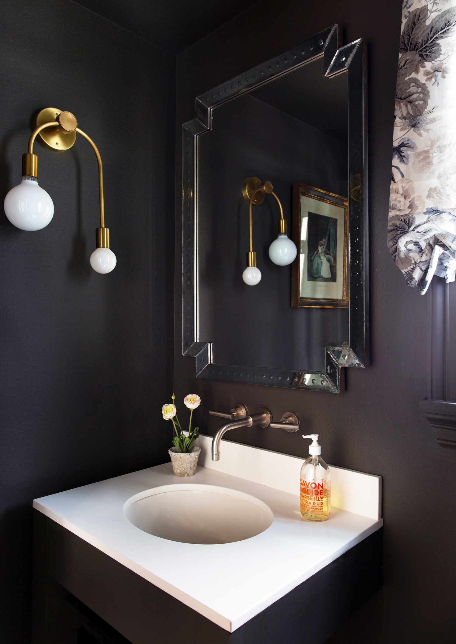 Dark bathroom with antique mirror