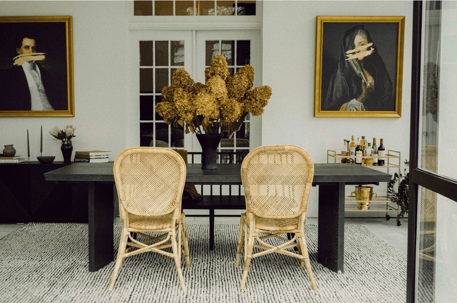 Dining room with painted portraits