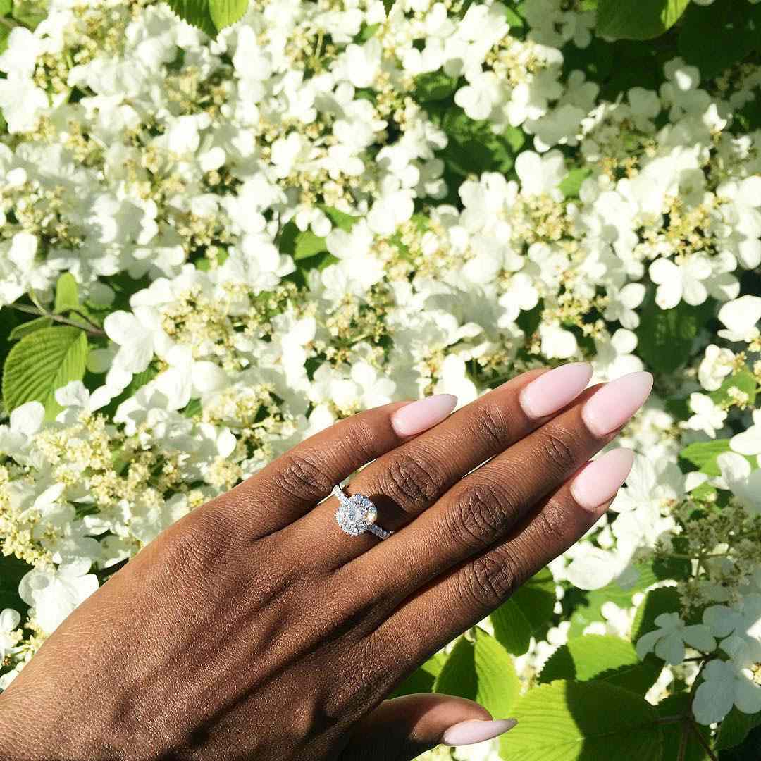engagement ring selfie white flowers and greenery