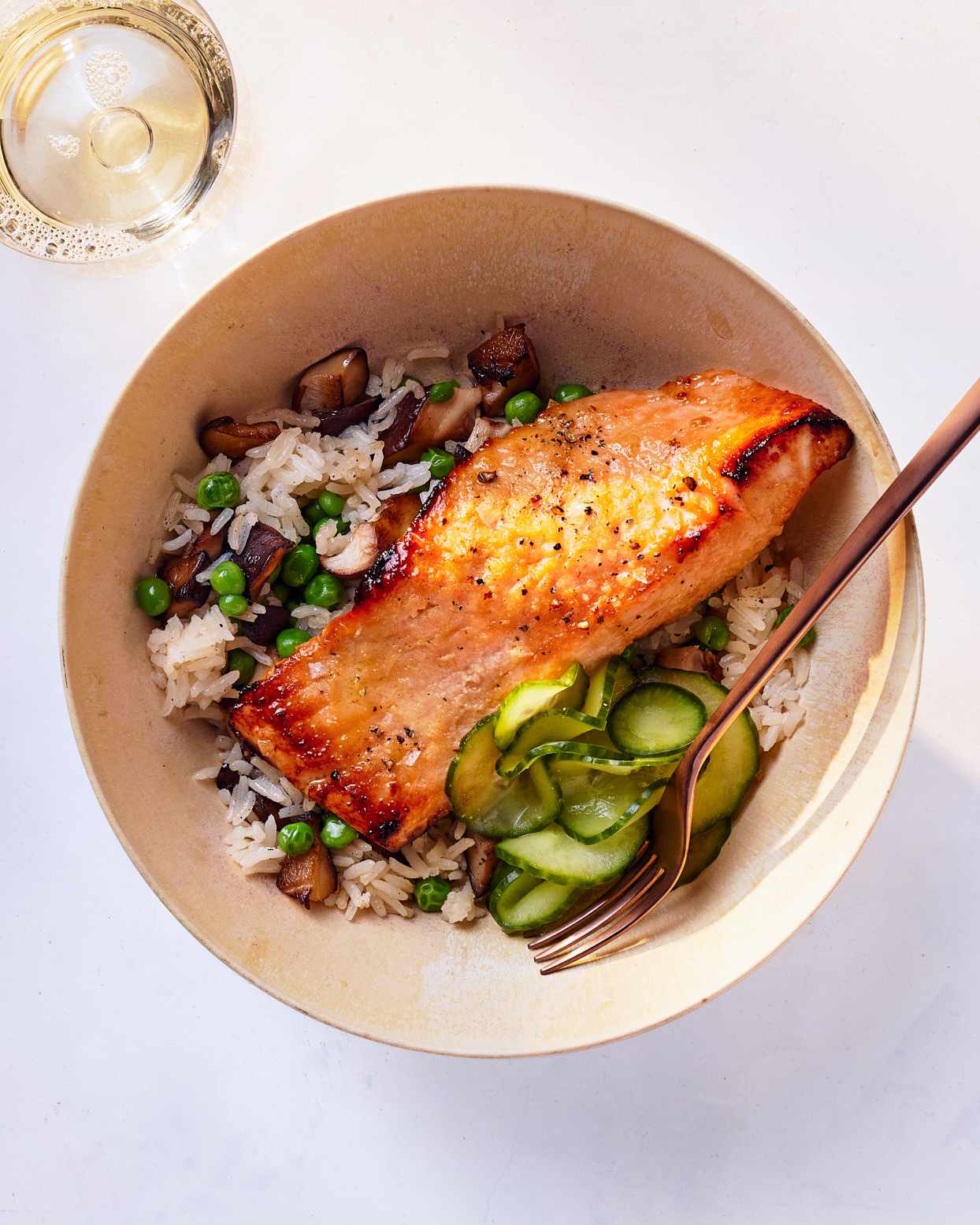 salmon-shiitake rice bowls served with cucumber