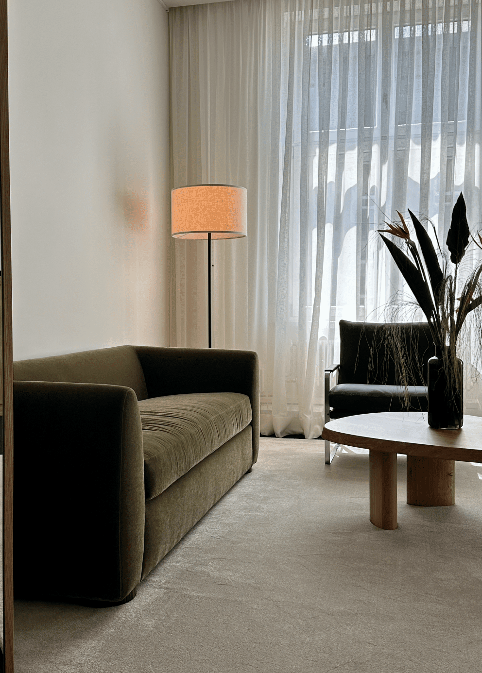 white walls with green sofa