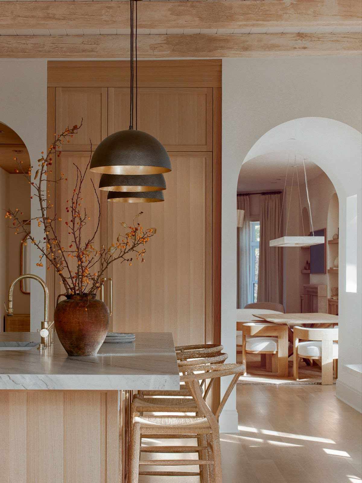 a kitchen with wood accents