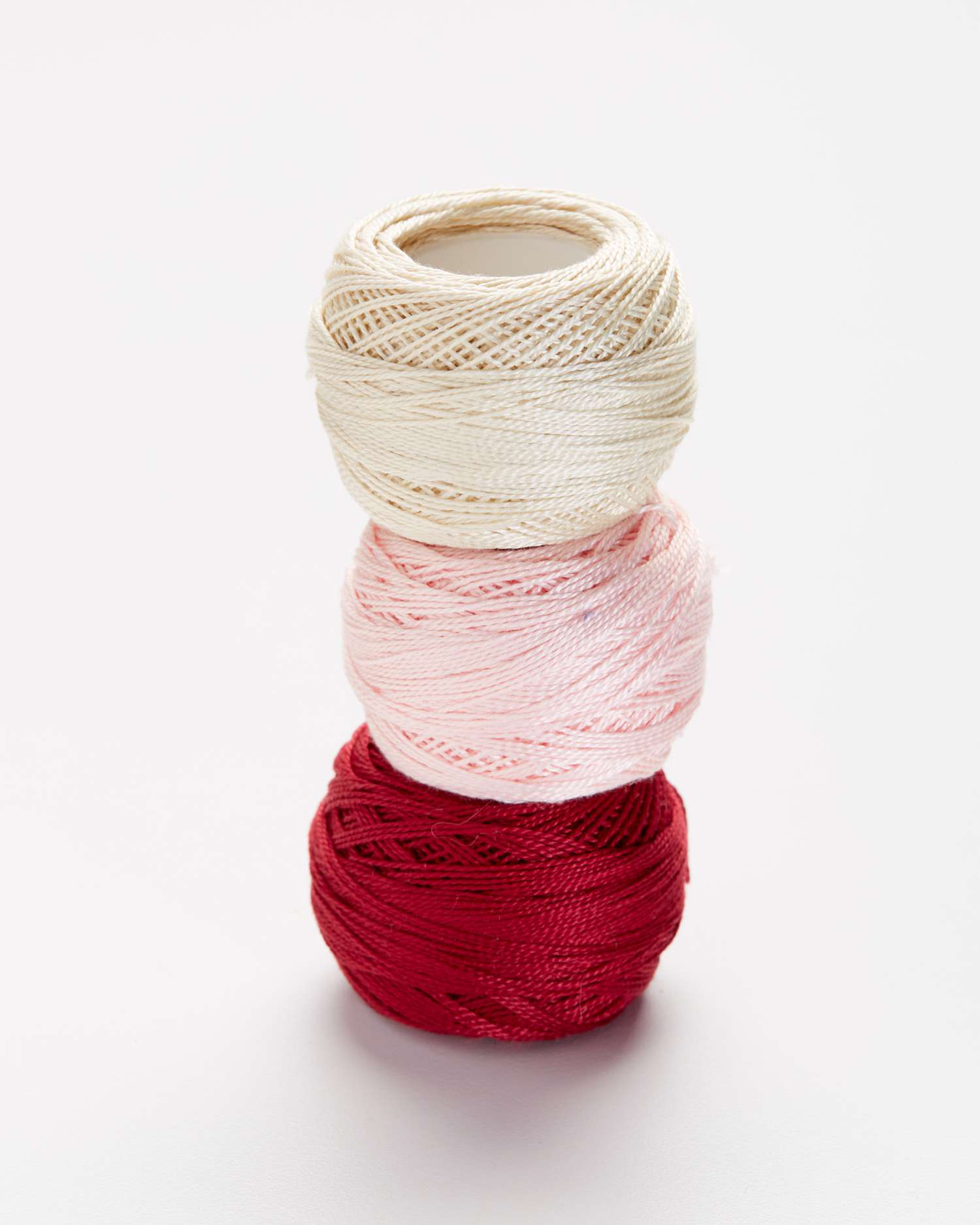 three types of cotton embroidery thread stacked