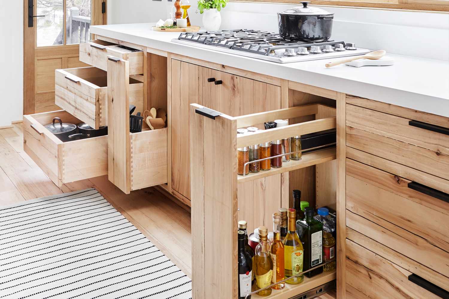 Pullout cabinets in a kitchen showing organization features