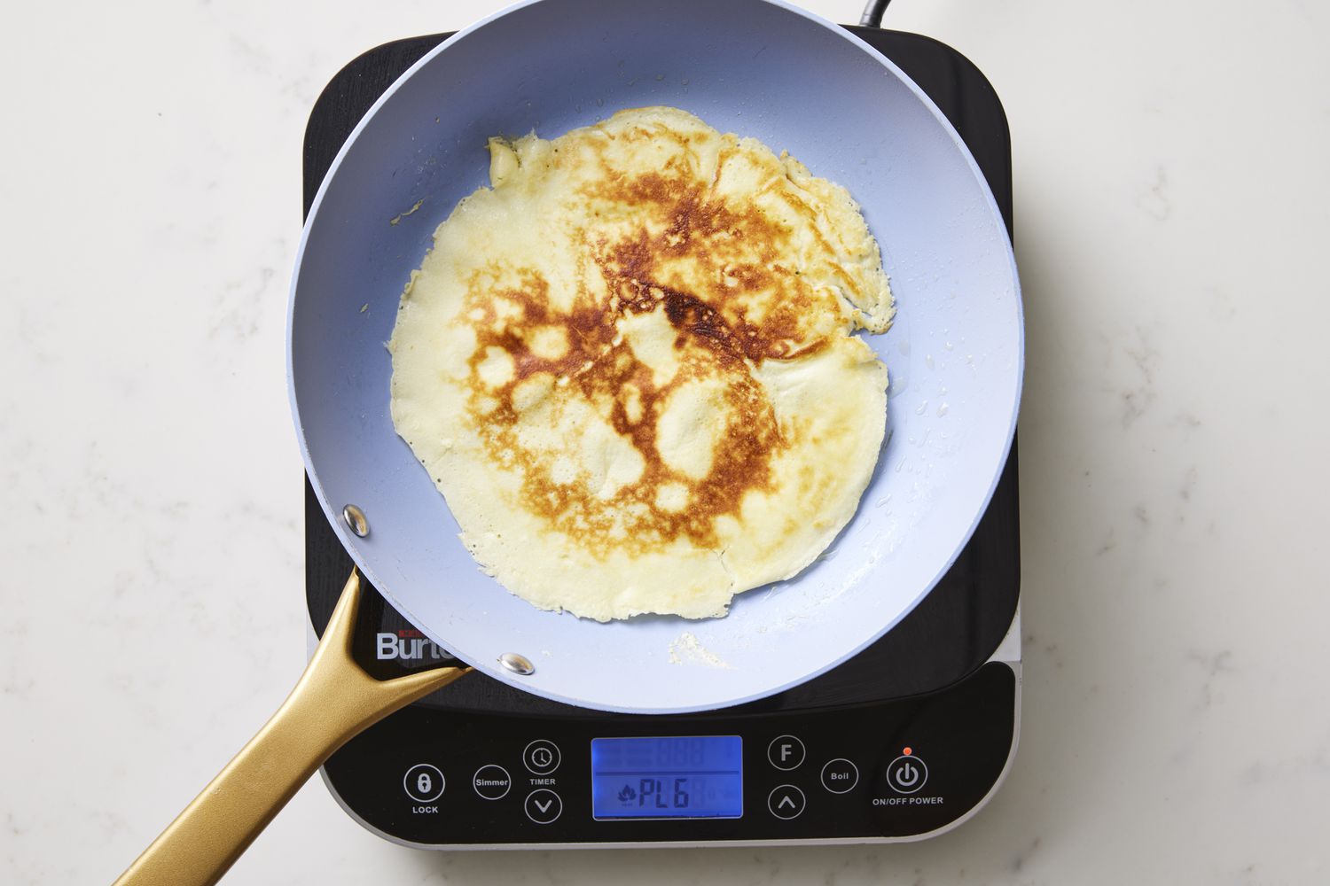 Flipped crepe in skillet