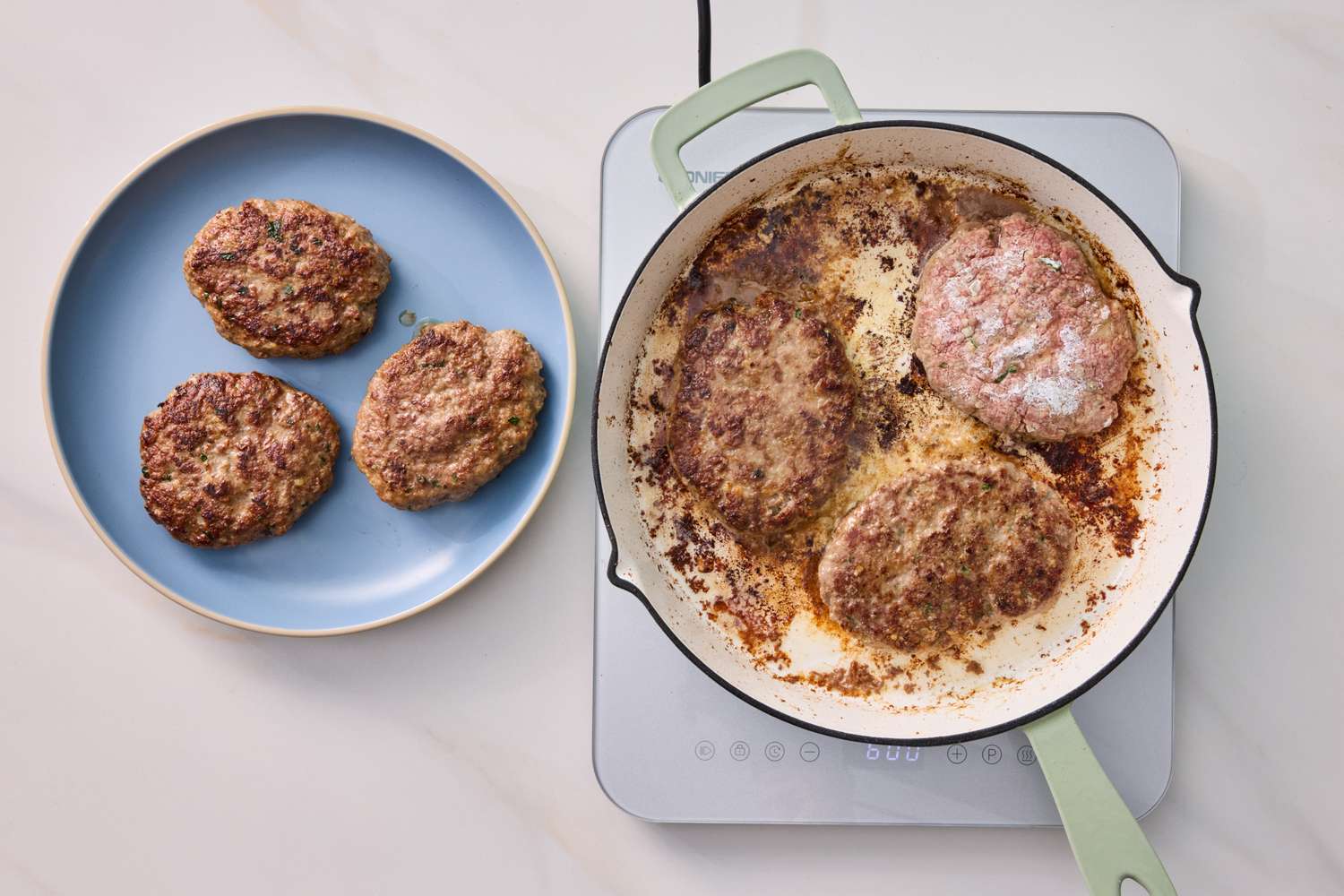 Salisbury steaks in a skillet and on a plate