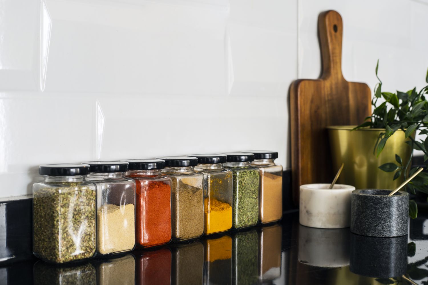 Various dried spices in glass jars