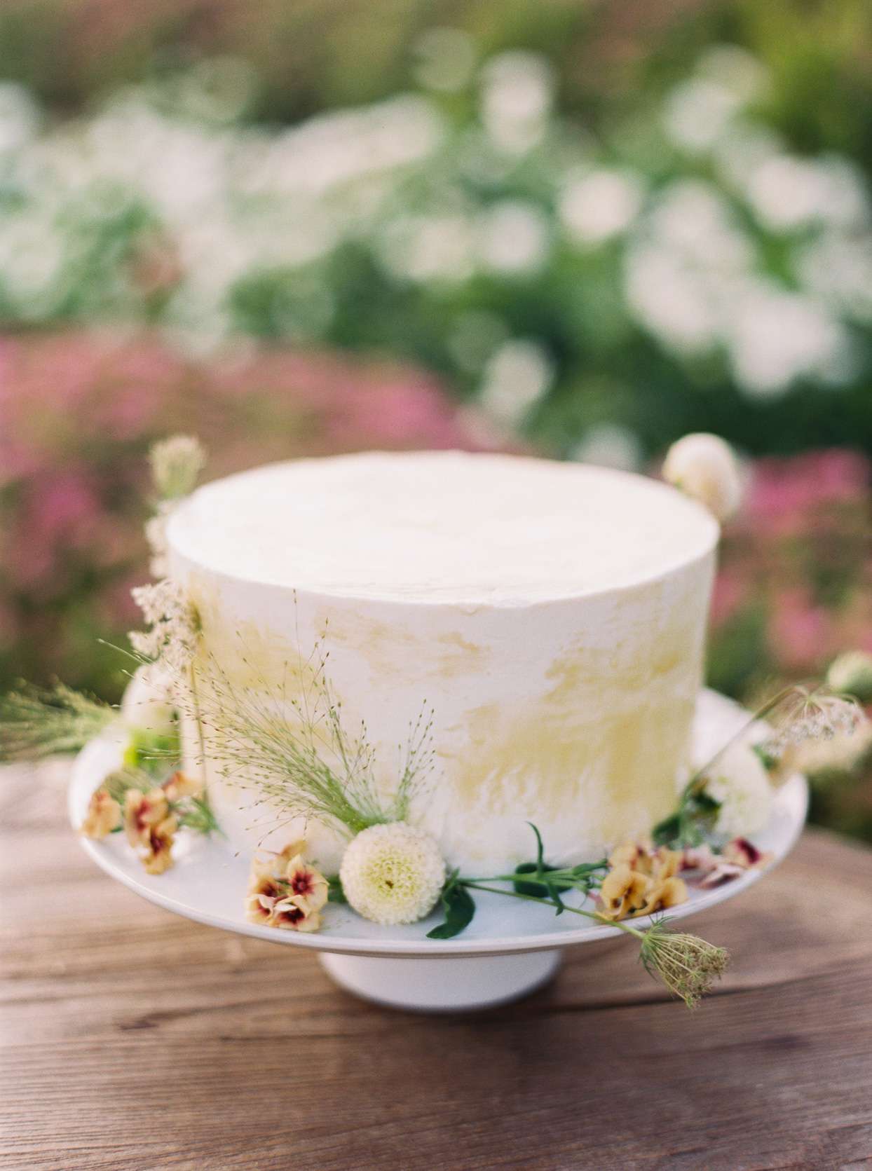 simple, single later wedding cake with small flowers