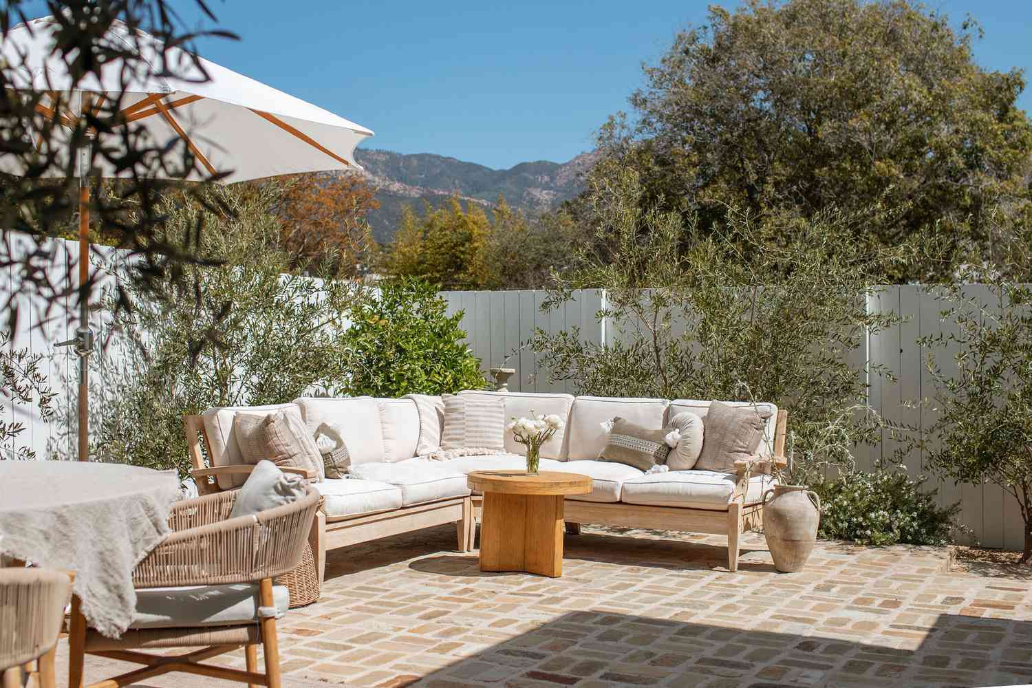 Backyard with white couch and plants