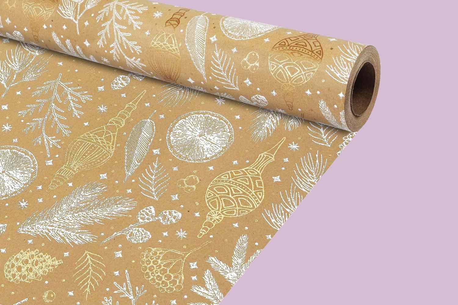 A roll of holidaythemed wrapping paper with decorative patterns of ornaments and festive elements on a lightcolored background against a pink backdrop